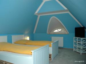 Ein Bett oder Betten in einem Zimmer der Unterkunft Landhaus Uhlenhof 4