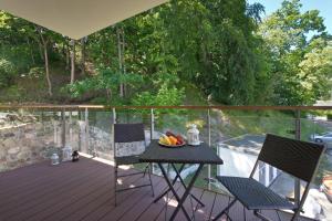 a table with a bowl of fruit on a deck at Apartament Aquarius Sopot in Sopot