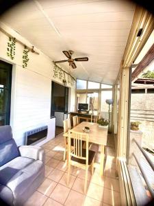 a living room with a table and a couch at ma calanque in Le Rove +39 photos