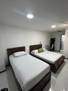 Postel nebo postele na pokoji v ubytování hotel torre 52 + 17 fotografií