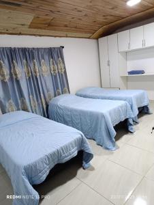 Postel nebo postele na pokoji v ubytování Casa Wilma