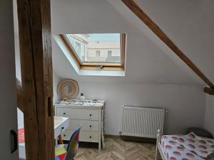 a attic room with a bed and a window at Private room at Ceausescu's place in Old City Unirii Square in Bucharest +130 photos