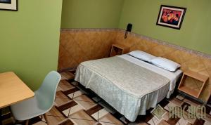 Postel nebo postele na pokoji v ubytování Hostal Residencial Mochica