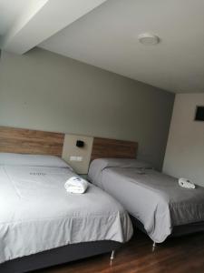 Кровать или кровати в номере Residencial Valle Grande