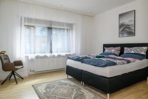 En eller flere senge i et værelse på Rehoboth Apart