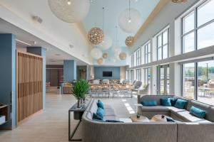 a large lobby with couches and a living room at Element Wilmington in Wilmington +2 photos