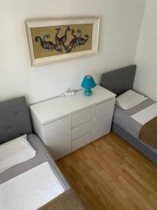 Postel nebo postele na pokoji v ubytování Sun Apartment