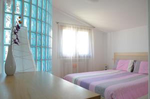 Postel nebo postele na pokoji v ubytování LA CASETTA - Margherita