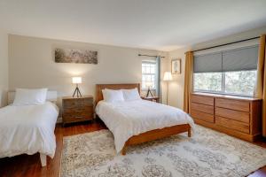 a bedroom with two beds and a window at Hot Tub and Game Room Family Retreat in Groveland! in Groveland +27 photos