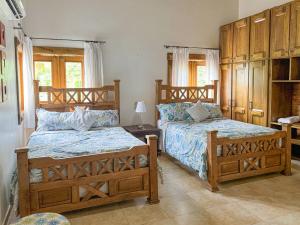 Giường trong phòng chung tại Spacious Tropical Villa with Pool 4Bedroom 7Beds 5Baths , Near Beach +24 ảnh
