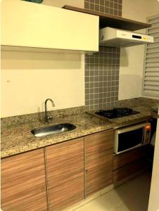 Kuchyň nebo kuchyňský kout v ubytování Caldas Novas - apartamento