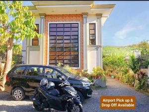 a motorcycle parked in front of a house at Compostela Guest Room #2 Terrace, Rooftop, Netflix, WiFi in Compostela