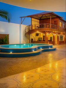 a swimming pool in the middle of a house at Hotel Pedernales MrRobert in Pedernales