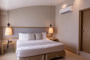 Katil atau katil-katil dalam bilik di Hotel Santa Cecilia B&B