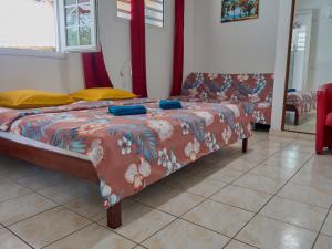 Postel nebo postele na pokoji v ubytování Le Pavillon Ananas