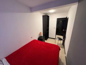 Ένα ή περισσότερα κρεβάτια σε δωμάτιο στο Hotel Bogotá Suites Teusaquillo
