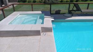 a lap swimming pool with a pool at Posada del Flamenco 2 in Miramar