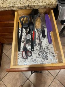 a drawer full of kitchen utensils on a counter at Dunbar Guest Home close downtown Vancouver, UBC and store in Vancouver +3 photos