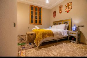 Postel nebo postele na pokoji v ubytování Riad Atlas Bangalow