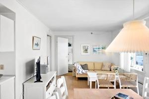 a living room with a couch and a table at 4170-Borre-Klintholm-Havneby-70 in Borre