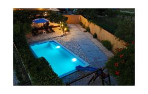 an overhead view of a swimming pool in a backyard at Two-Bedroom Holiday Home In Sibenik in Šibenik