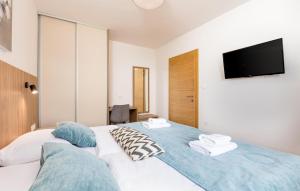 Ένα ή περισσότερα κρεβάτια σε δωμάτιο στο 2 Bedroom Lovely Apartment In Malinska