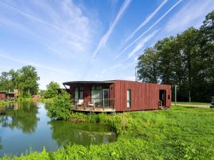 a rendering of a house on the side of a river at Vacation House in Tournai Award-Winning Park in Antoing
