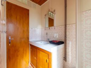 a bathroom with a sink and a mirror at Cevennes Stone Retreat in Saint-Germain-de-Calberte +32 photos