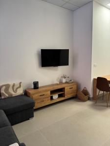 a living room with a flat screen tv on a wall at Basset 2 in Valencia