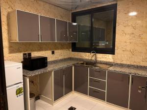 Η κουζίνα ή μικρή κουζίνα στο Aryaf Hotel Apart Tabasum Group