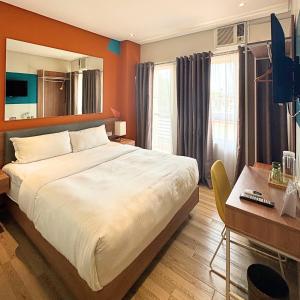 TV a/nebo společenská místnost v ubytování Luxebridge Hotel