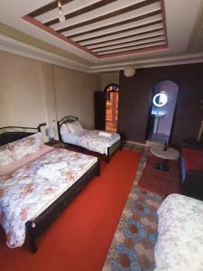 A bed or beds in a room at riad lala fatima
