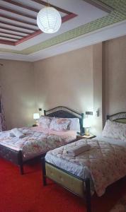 A bed or beds in a room at riad lala fatima