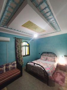 A bed or beds in a room at riad lala fatima