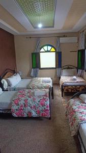 A bed or beds in a room at riad lala fatima