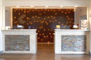 a lobby with a wall with lights on it at Comfort Suites Texarkana Texas in Texarkana - Texas +85 photos