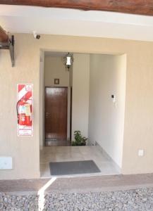 a living room with a pepsi sign on the wall at El Sueño in Salta +17 photos