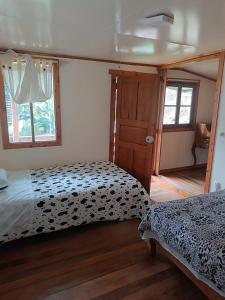 Voodi või voodid majutusasutuse Cabaña con linda vista en Oxapampa toas