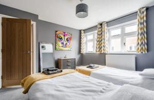 Ένα ή περισσότερα κρεβάτια σε δωμάτιο στο Stylish 2 Bed Apart In The Heart of North Norfolk