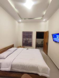 Postel nebo postele na pokoji v ubytování Agg