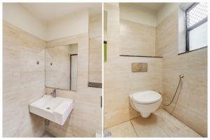 a bathroom with a toilet and a sink at Super Townhouse Sikar Road Jaipur Formerly Hotel Aroma Inn in Jaipur