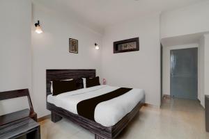 Super Collection O Vaishno Devi Temple Formerly Hotel The Leaf客房内的一张或多张床位