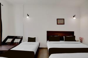 Super Collection O Vaishno Devi Temple Formerly Hotel The Leaf客房内的一张或多张床位