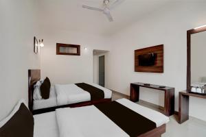 Super Collection O Vaishno Devi Temple Formerly Hotel The Leaf客房内的一张或多张床位