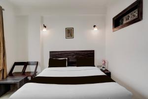 Super Collection O Vaishno Devi Temple Formerly Hotel The Leaf客房内的一张或多张床位