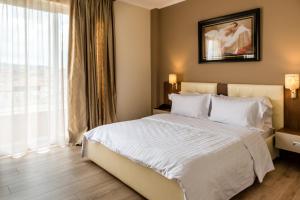 Postel nebo postele na pokoji v ubytování KEIT Hotel