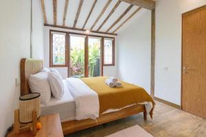 Кровать или кровати в номере Singgah di Ubud 1