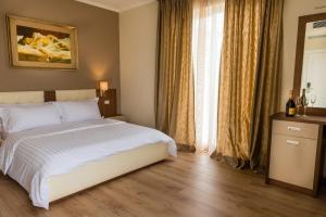 Postel nebo postele na pokoji v ubytování KEIT Hotel