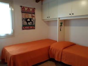 Postel nebo postele na pokoji v ubytování Terrazzo sul mare