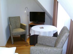TV a/nebo společenská místnost v ubytování Hotel Gode Wind